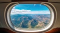 Aerial view of beautiful mountains seen through a luxury private helicopter window