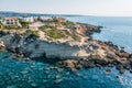 Aerial view of beautiful nature cliff with villas or houses near Coral Bay beach in Paphos, Cyprus. Drone photo of Royalty Free Stock Photo