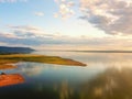 Aerial view  Beautiful Orange and red dramatic colors of sunset and cirrus clouds above the sea. Sky blue and orange natural dawn Royalty Free Stock Photo