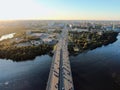 Aerial view beautiful panoramic cityscape at sunset. traffic of cars and passenger ships in the big city. drone shot Royalty Free Stock Photo