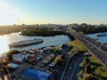 Aerial view beautiful panoramic cityscape at sunset. traffic of cars and passenger ships in the big city. drone shot Royalty Free Stock Photo