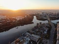 Aerial view beautiful panoramic cityscape at sunset. traffic of cars and passenger ships in the big city. drone shot Royalty Free Stock Photo