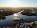 Aerial view beautiful panoramic cityscape at sunset. traffic of cars and passenger ships in the big city. drone shot Royalty Free Stock Photo