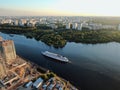 Aerial view beautiful panoramic cityscape at sunset. traffic of cars and passenger ships in the big city. drone shot Royalty Free Stock Photo