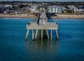 Aerial view of a beautiful pier on the shores of Wilmington beach in North Carolina Royalty Free Stock Photo