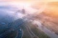 Aerial view of beautiful railroad bridge and river in fog in fall Royalty Free Stock Photo