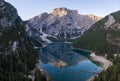 Aerial view of the beautiful reflection of Seekofel mountain in Lake Braies at sunrise, Italy