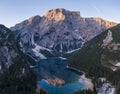 Aerial view of the beautiful reflection of Seekofel mountain in Lake Braies at sunrise, Italy