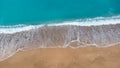 Aerial view of beautiful sandy beach and soft turquoise ocean wave. Tropical sea in summer season on Megali Petra beach on Lefkada