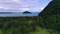 Aerial view of beautiful savannah, pond and beautiful beach with pine trees in babah Ie village in Aceh Jaya, Indonesia.