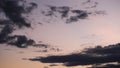 Aerial view of beautiful sky with clouds and sunlight during sunset. Time lapse of the clouds above the sky with the golden rays Royalty Free Stock Photo