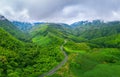 Aerial view of Beautiful sky road over top of mountains with green jungle in Nan province, Thailand