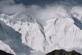 Aerial view of beautiful snow-capped mountains under a bright sunlight