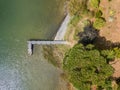 Aerial view of beautiful stone pier in Furnas lagoon, Azores islands. Drone landscape view with lines and textures. Top view of r