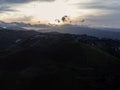 Aerial view of beautiful sunrise or sunset sky and rural villages. Village landscape in misty valley and mountain clouds in Royalty Free Stock Photo