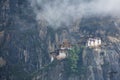 Aerial view of the beautiful Taktsang Palphug Monastery in Paro, Bhutan with fog everywhere