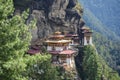Aerial view of the beautiful Taktsang Palphug Monastery in Paro, Bhutan surrounded by greenery
