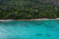 Aerial view of beautiful tropical beach with crystal clear lagoon sea Royalty Free Stock Photo