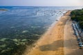 Aerial view of a beautiful tropical beach in late afternoon sunshine