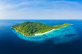 Aerial view of a beautiful tropical island surrounded by coral reef and a clear ocean Royalty Free Stock Photo