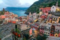 Aerial view of beautiful Vernazza in early morning light, an amazing village of colorful houses perched on rocky