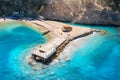 Aerial view of beautiful wooden pier, sea bay, sandy beach Royalty Free Stock Photo