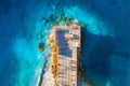 Aerial view of beautiful wooden pier, sea bay, sandy beach Royalty Free Stock Photo