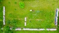 Aerial view of beekeeper as he mowing a lawn in his apiary with a petrol lawn mower Royalty Free Stock Photo