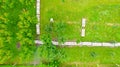 Aerial view of beekeeper as he mowing a lawn in his apiary with a petrol lawn mower Royalty Free Stock Photo