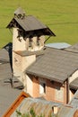 Aerial view of the bell tower of Saint Sebastien Church, with a Cross of Jesus Christ and a sundial, Ceillac