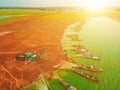 Aerial view of Ben Nom fishing village, a brilliant, fresh, green image of the green algae season on Tri An lake, with many Royalty Free Stock Photo