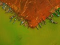 Aerial view of Ben Nom fishing village, a brilliant, fresh, green image of the green algae season on Tri An lake, with many Royalty Free Stock Photo