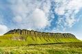 Aerial view of Benbulbin, aka Benbulben or Ben Bulben, iconic landmark, flat-topped nunatak rock formation. Magnificent costal Royalty Free Stock Photo