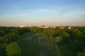 Aerial View of Berlin Park Hasenheide in Kreuzberg on an Spring afternoon with people relaxing and having fun on a large meadow in