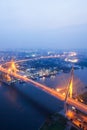 Aerial view of Bhumibol Suspension Bridges and highways interchange over the Chao Phraya River at dusk. Samut Prakan, Thailand Royalty Free Stock Photo