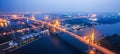 Aerial view of Bhumibol Suspension Bridges and highways interchange over the Chao Phraya River at dusk. Samut Prakan, Thailand Royalty Free Stock Photo