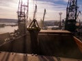 Aerial view of big cargo ship bulk carrier is loaded with grain of wheat in port at sunset Royalty Free Stock Photo