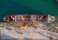 Aerial view of big cargo ship bulk carrier is loaded with grain of wheat in port at sunset Royalty Free Stock Photo