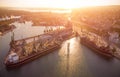 Aerial view of big cargo ship bulk carrier is loaded with grain of wheat in port at sunset Royalty Free Stock Photo