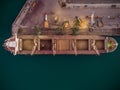 Aerial view of big cargo ship bulk carrier is loaded with grain of wheat in port at sunset Royalty Free Stock Photo