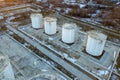 Aerial view of big fuel reservoires in petrol industrial zone in winter