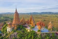 Aerial view of Big Golden Buddha Statue and pagoda in Tiger Cave Temple or Wat Tham Suea in Kanchanaburi province, Thailand.