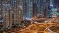 Aerial view on Dubai Marina with big highway intersection night timelapse and skyscrapers around, UAE Royalty Free Stock Photo