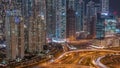 Aerial view on Dubai Marina with big highway intersection night timelapse and skyscrapers around, UAE Royalty Free Stock Photo