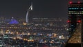 Aerial view of a big modern city at night timelapse. Business bay, Dubai, United Arab Emirates. Royalty Free Stock Photo