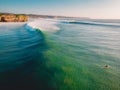 Aerial view of big perfect waves in ocean. Biggest wave and surfer in Bali Royalty Free Stock Photo