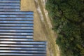 Aerial view of big sustainable electric power plant with many rows of solar photovoltaic panels for producing clean