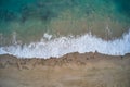 Aerial view of big white wave bubbles on the beach Royalty Free Stock Photo