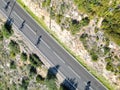 Aerial view of bikers riding on the highway on a sunny day Royalty Free Stock Photo