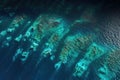 aerial view of bioluminescent waves creating patterns in the ocean